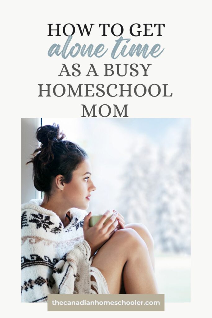 Woman sitting curled up wtih a mug looking out a window with text overlay that reads how to get alone time as a busy homeschool mom.
